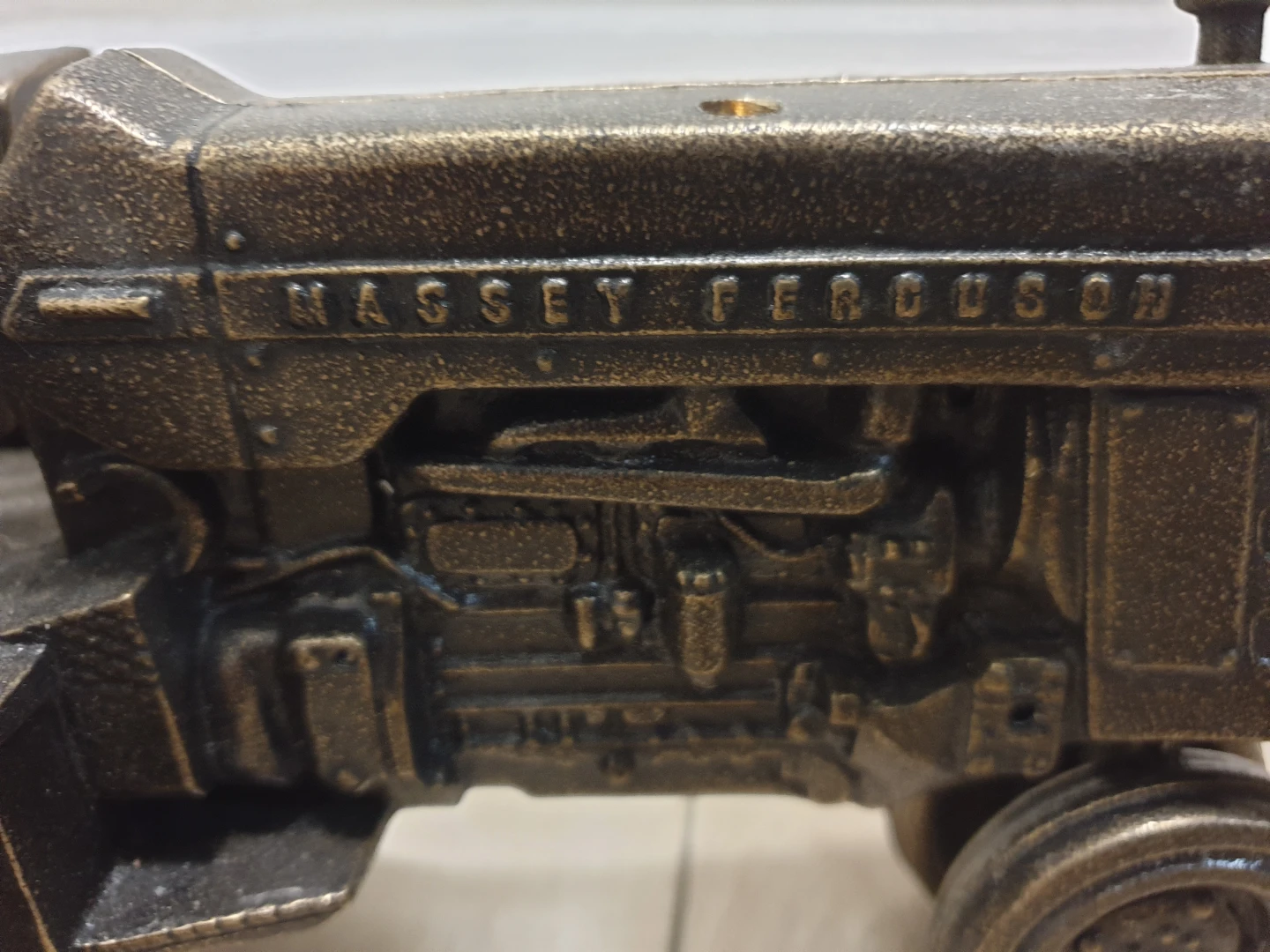 Collectible brass replica of a Massey Ferguson 1100 tractor - photo 3