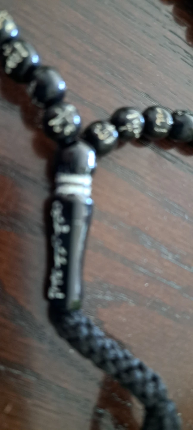 Black prayer beads with Arabic calligraphy
