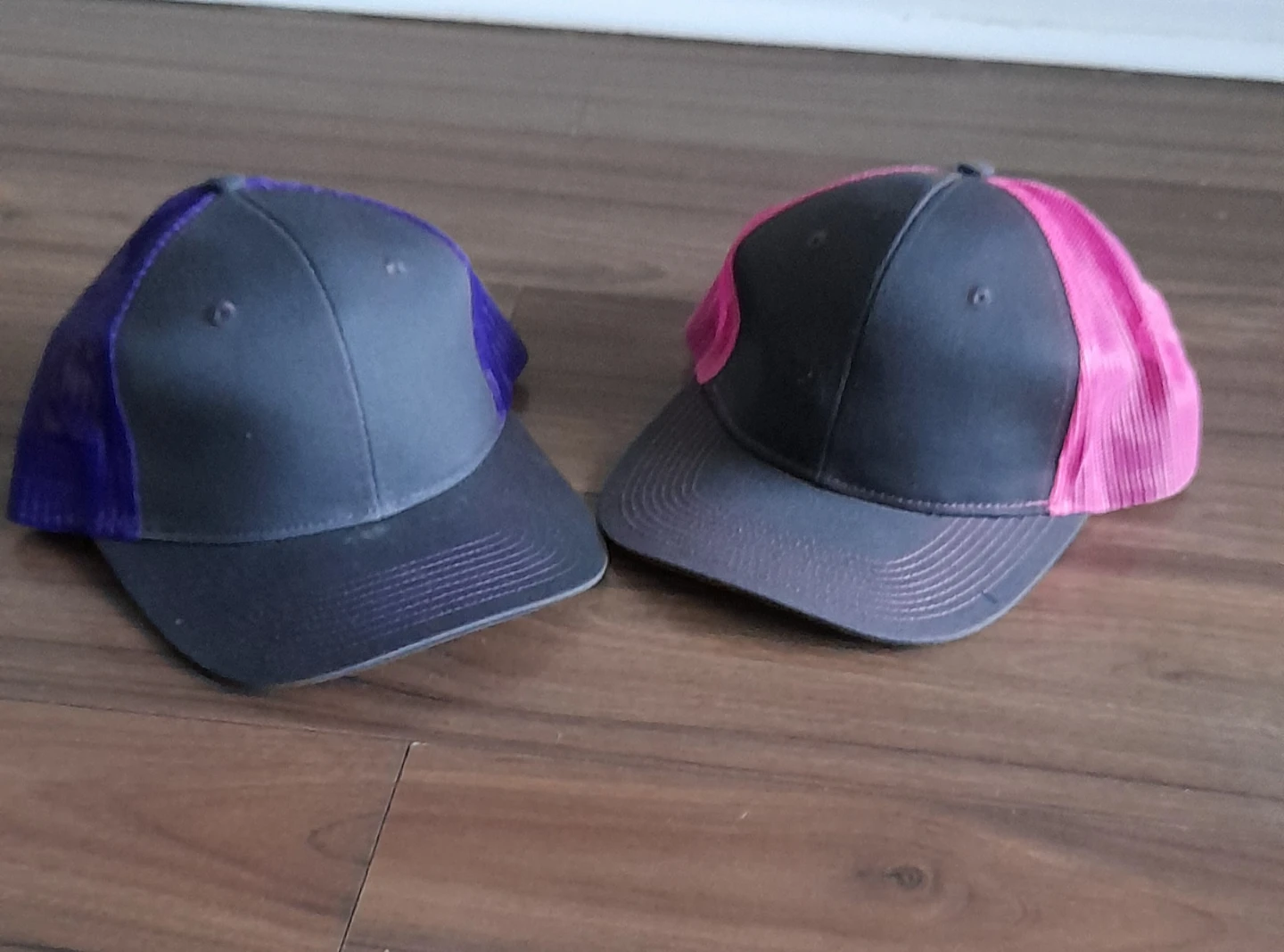 Two trucker hats - grey with purple and pink mesh