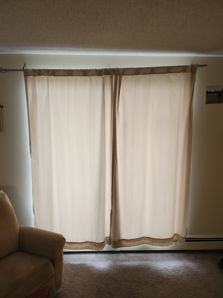 Pair of light beige curtains