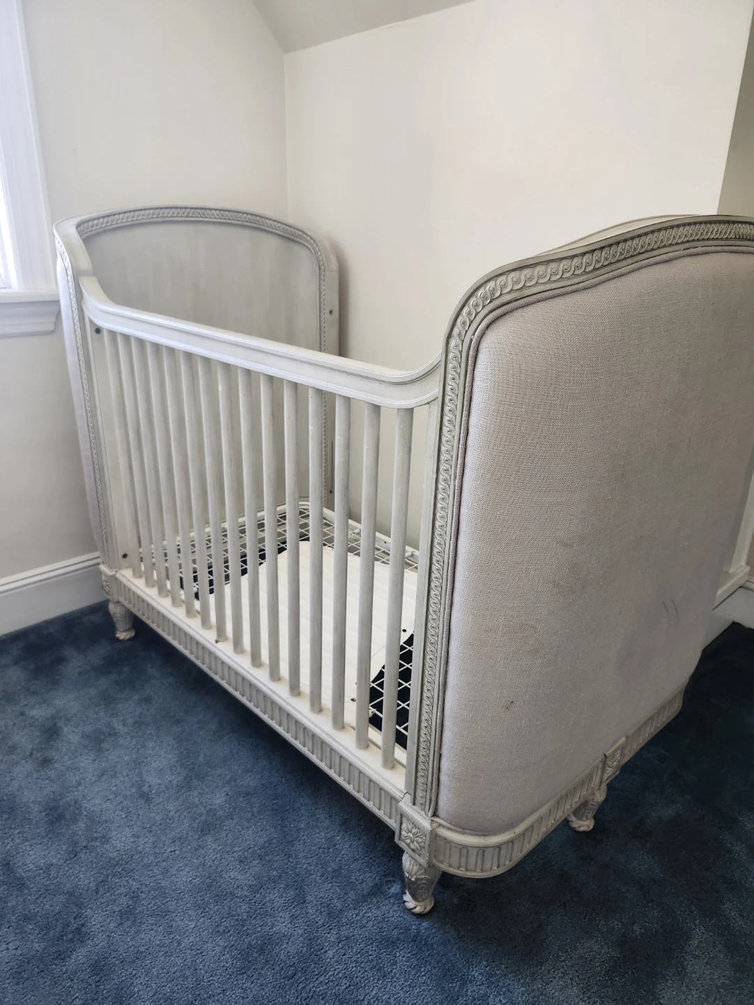 Upholstered RH Crib with Decorative Trim