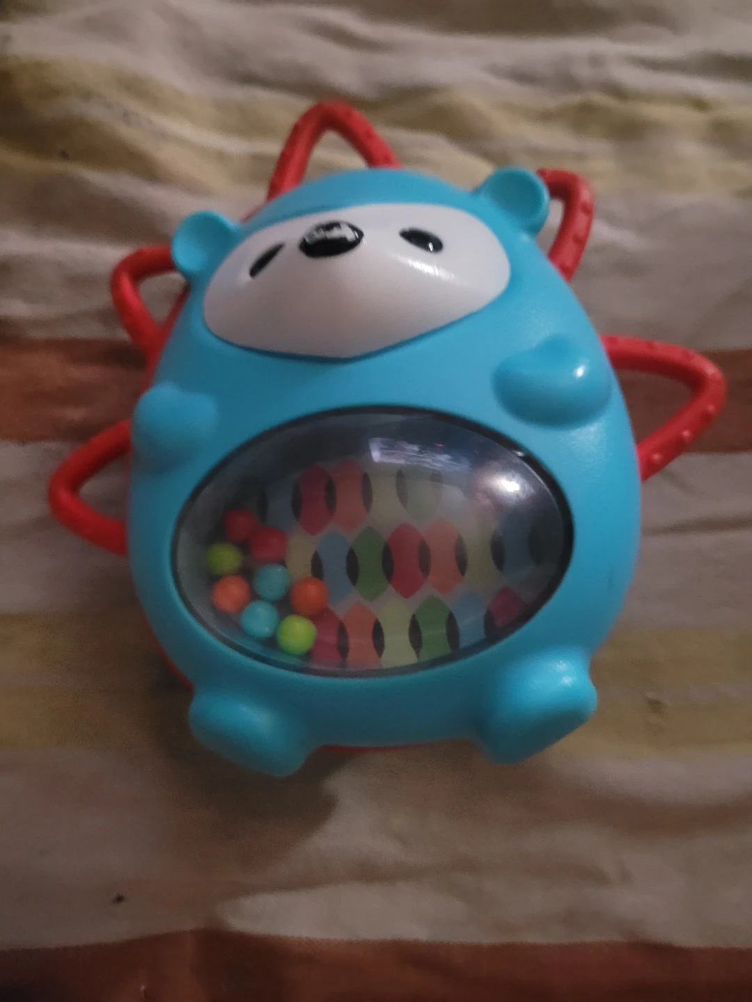 Skip Hop Explore and More Roll-Around Hedgehog baby toy.