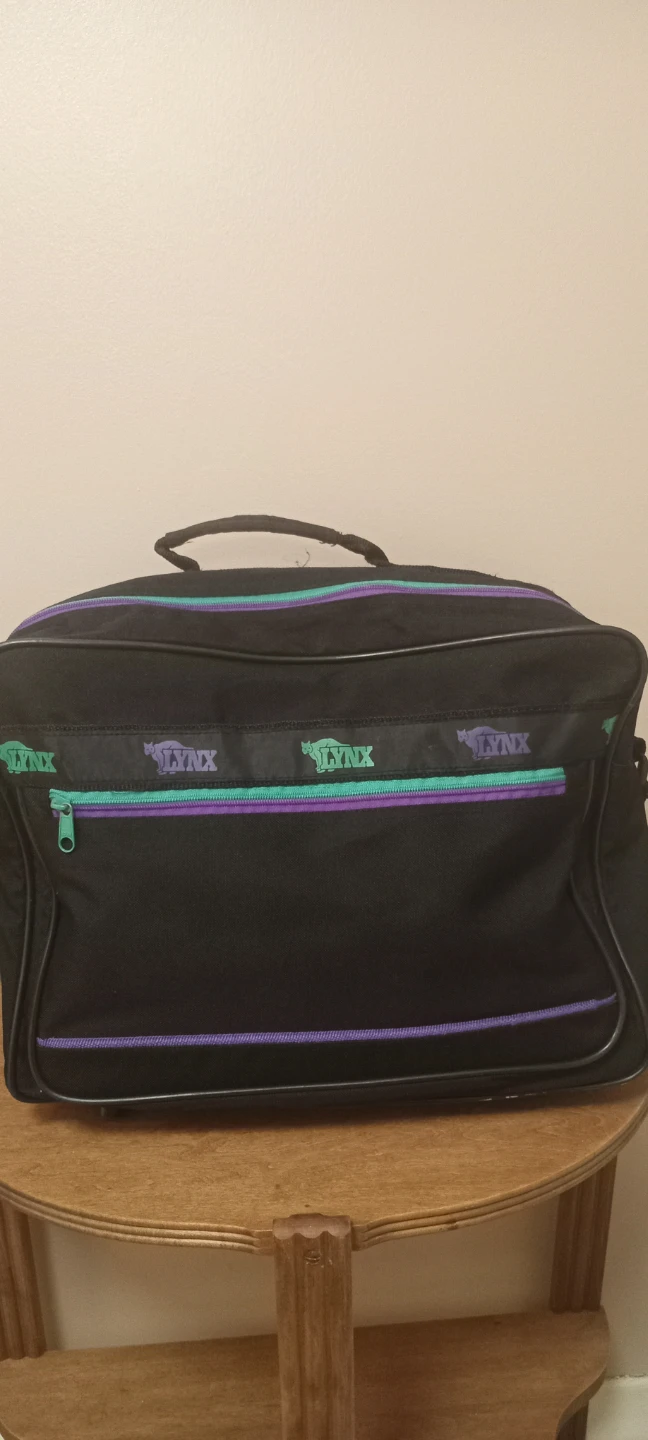 Lynx Black Duffel Bag with Purple and Green Accents
