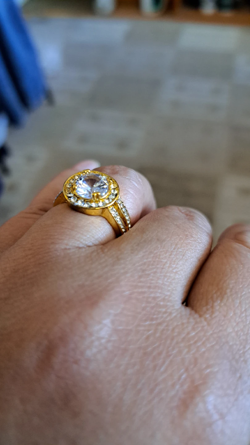Gold-tone engagement ring with clear stones