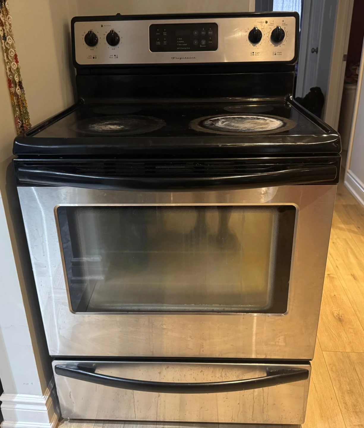 Frigidaire Electric Stove and dining table  with 4 chairs