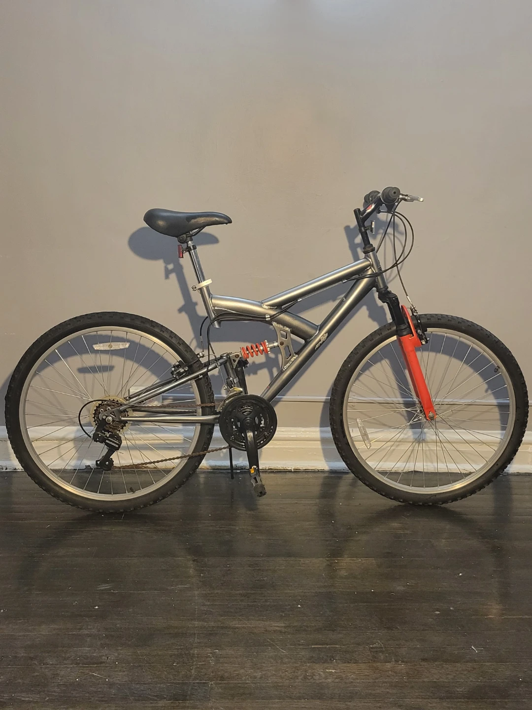 Gray Full Suspension Mountain Bike with Red Accents