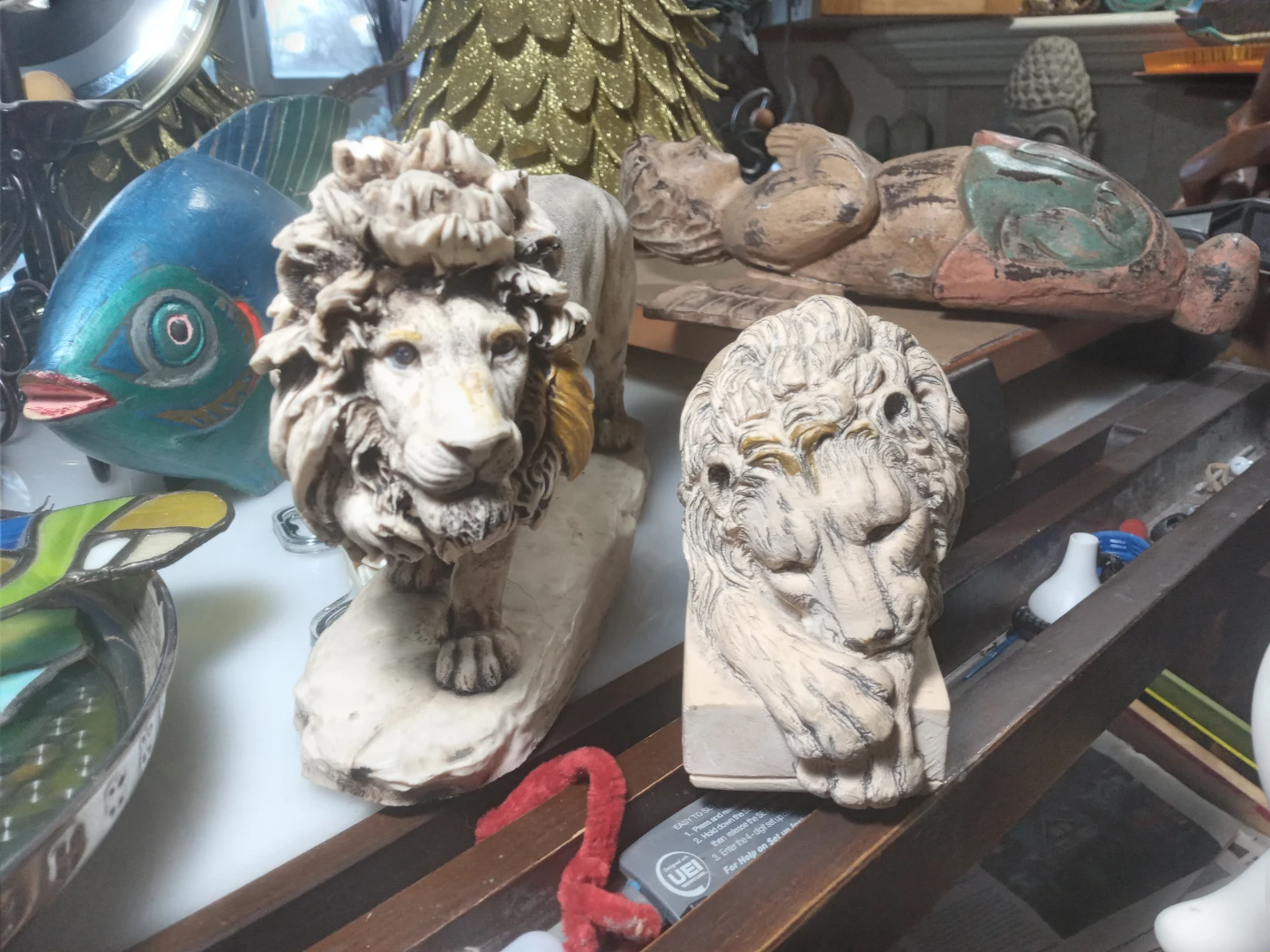 Lion Statues and Framed Art