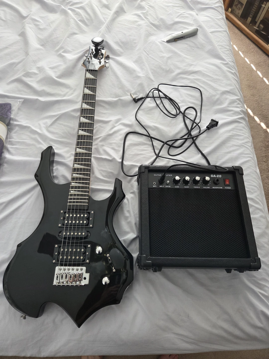 Black Electric Guitar with Amplifier