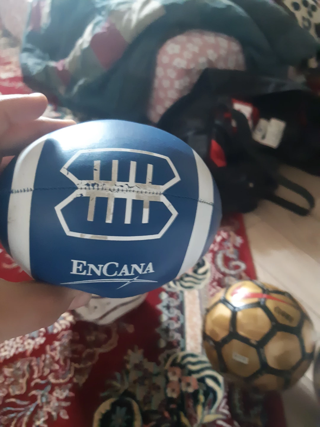 Soccer balls and a small American football. - photo 4