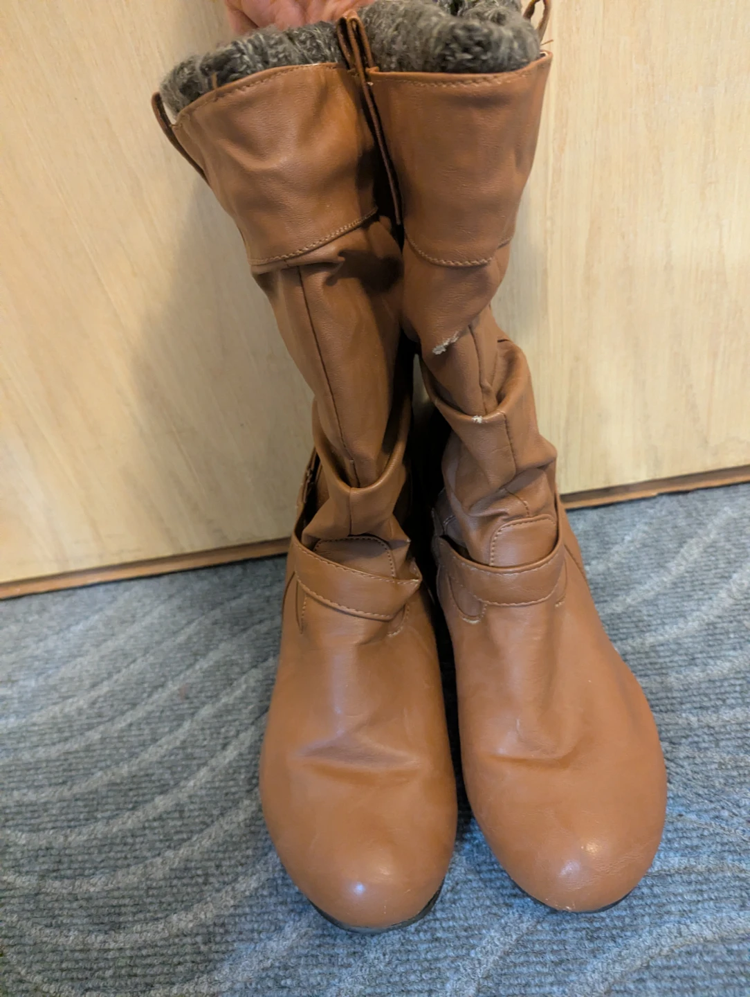 Brown slouchy boots with knitted cuffs