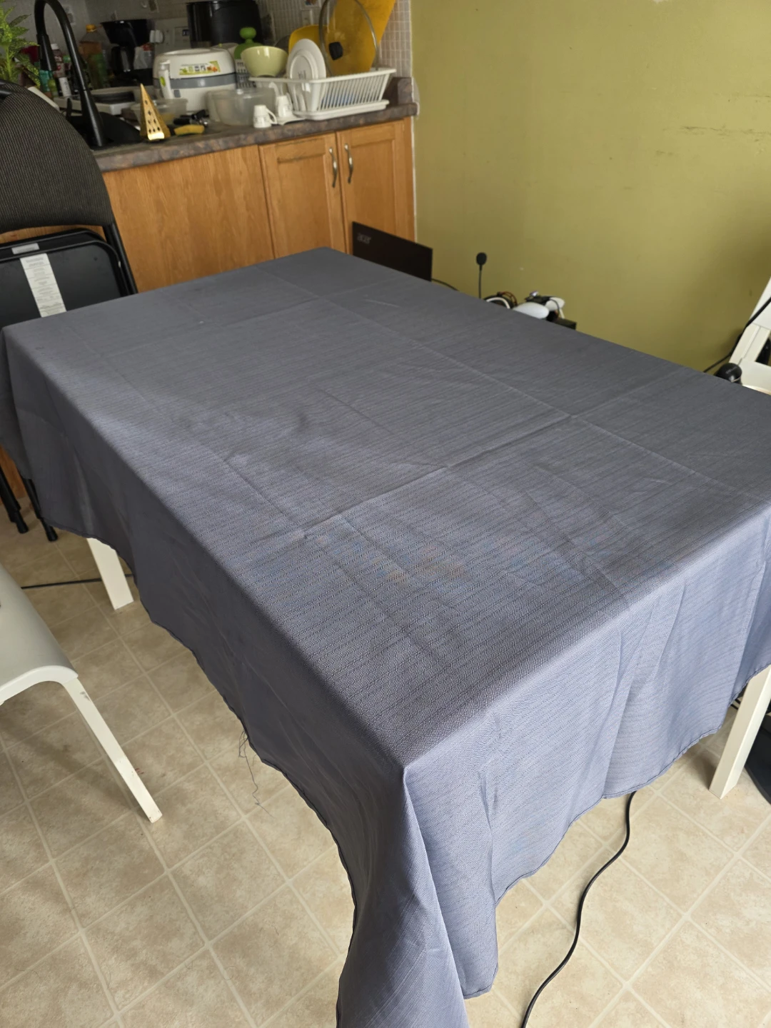 White Dining Table with Grey Tablecloth