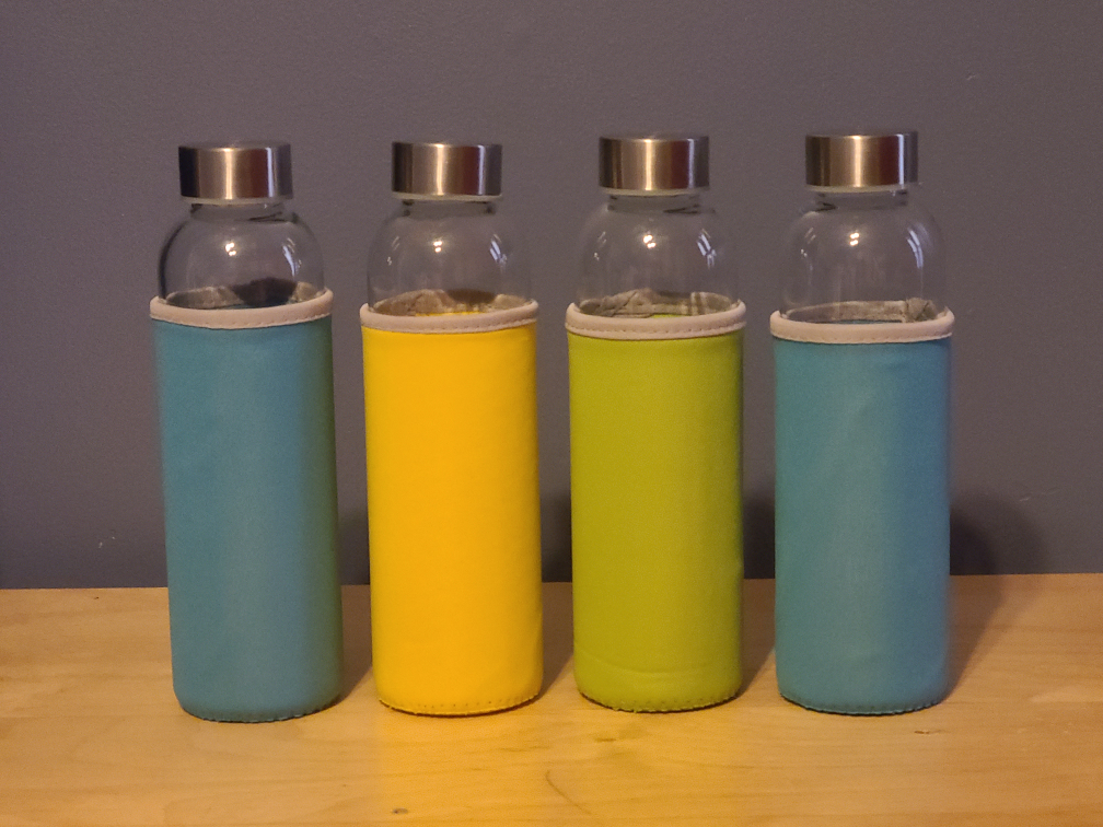 Set of 4 Glass Juicing Bottles with Sleeves