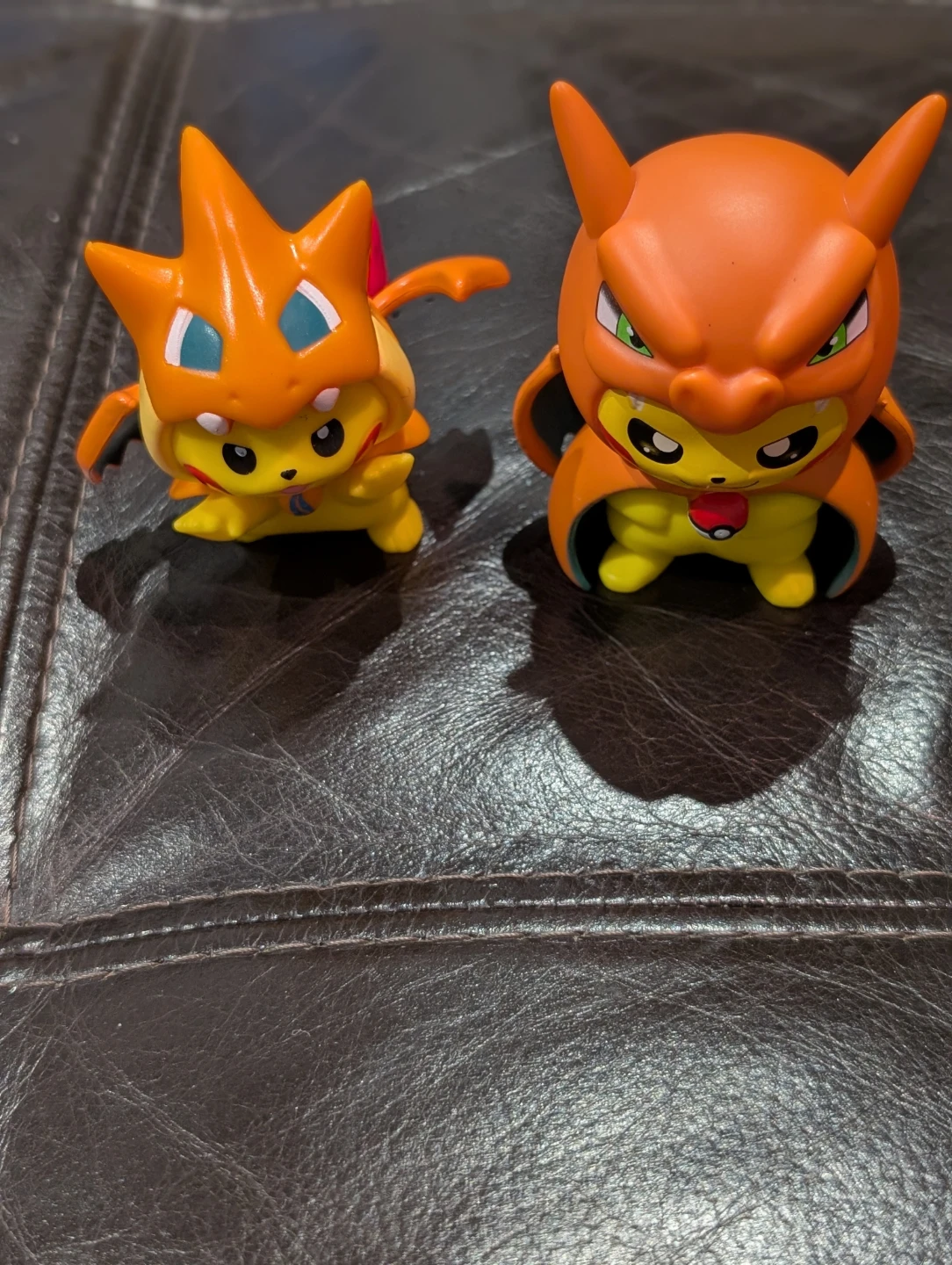 Two Pokemon  figures 3" inch Pikachu Poncho Charizard