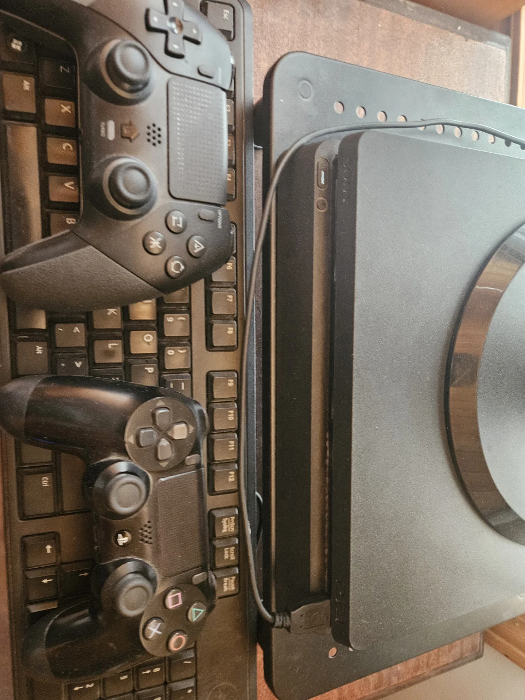 Dell Monitor with Sony PlayStation 4 Console and Controllers