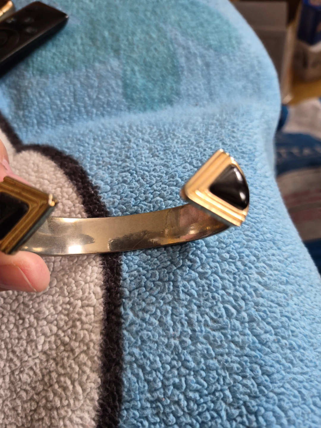 Gold Tone Cuff Bracelet with Black Stone