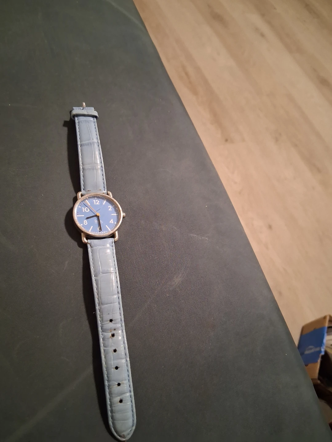 Blue analog watch with crocodile-style band