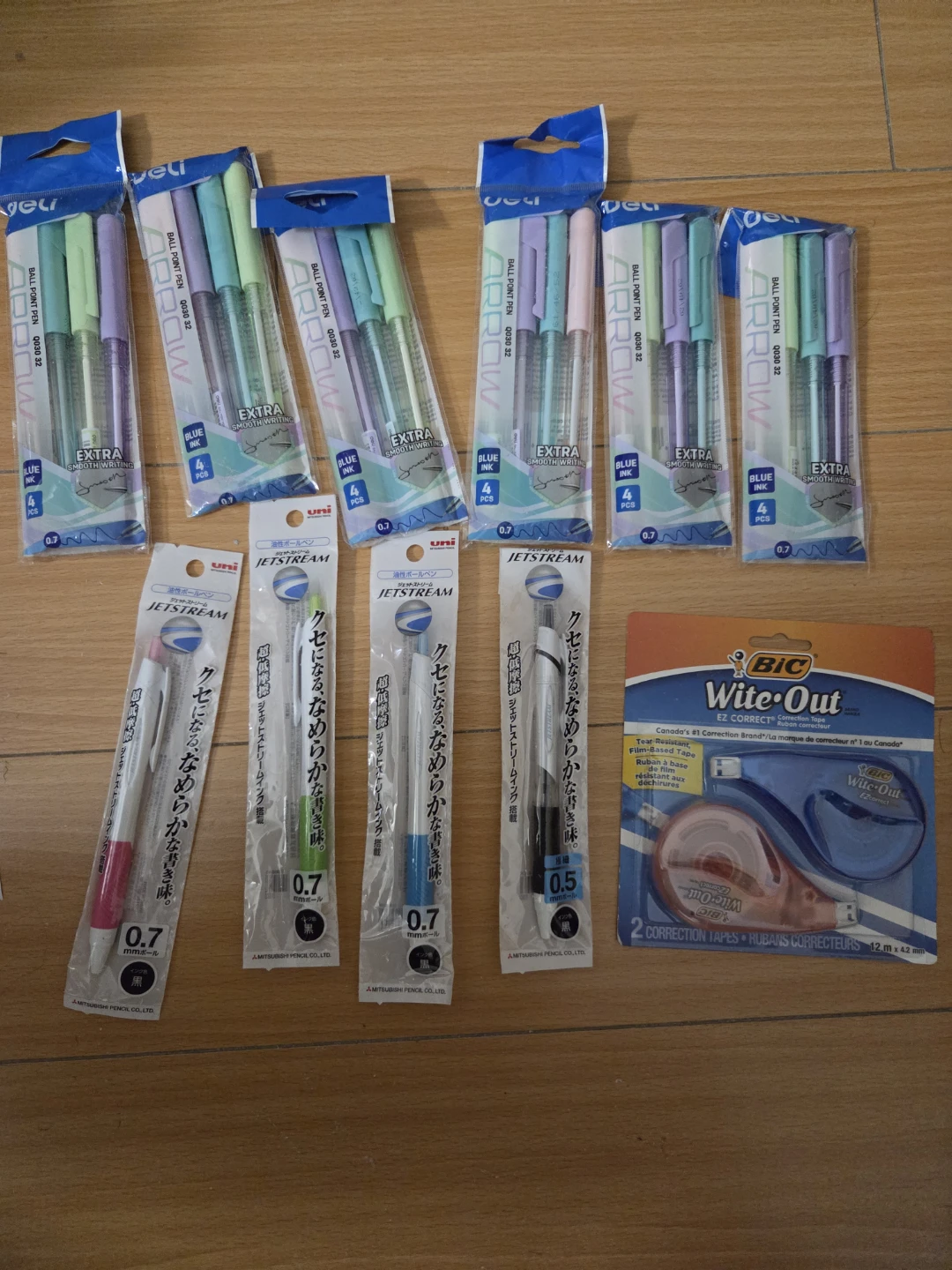 6 packs deli pens, 4 black click pens and pack or whiteout