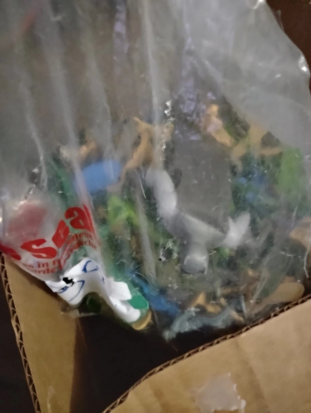 Bag of assorted toys including Pokémon cards and action figures - photo 3