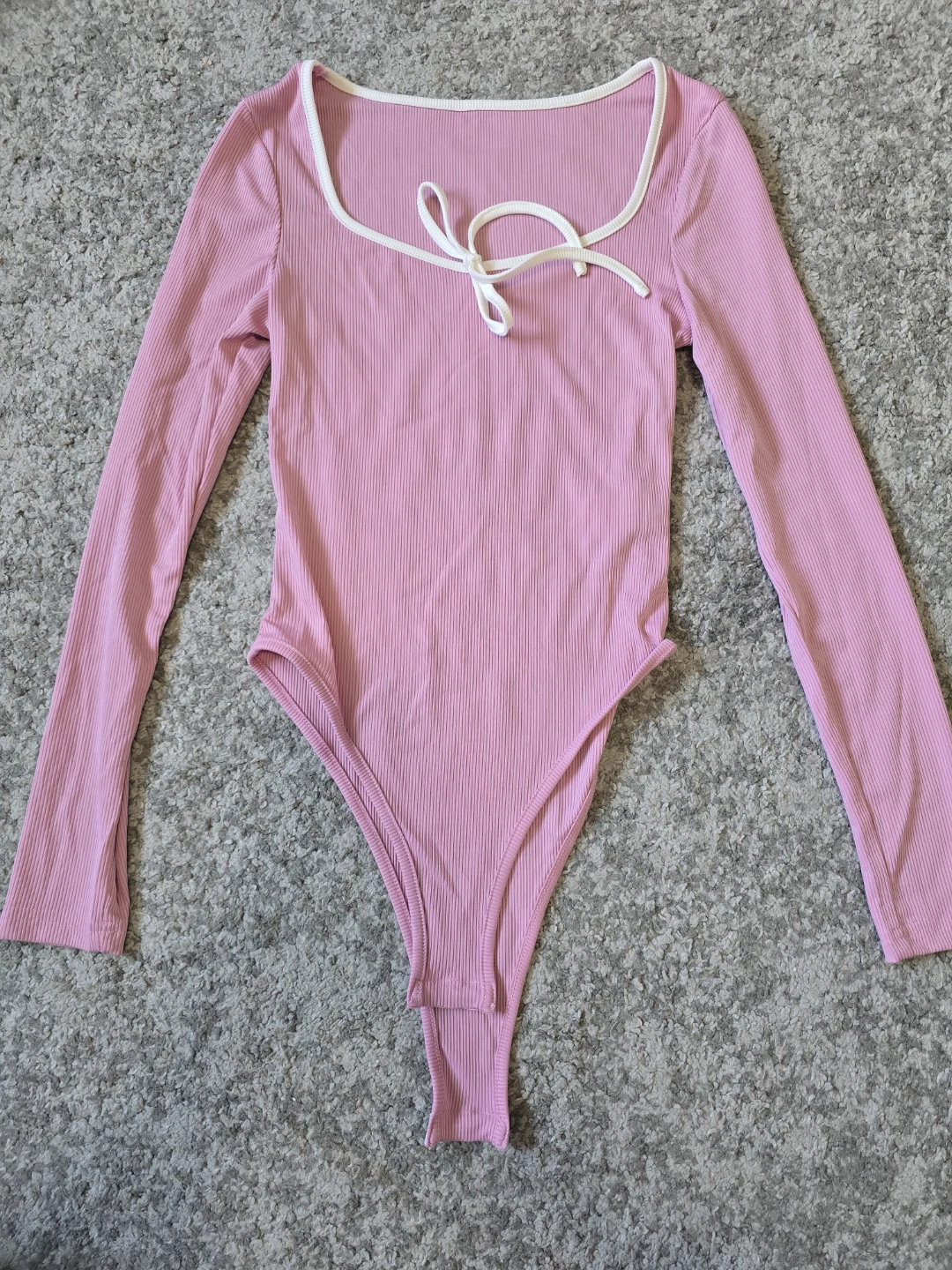 Pink Ribbed Long Sleeve Bodysuit with White Trim