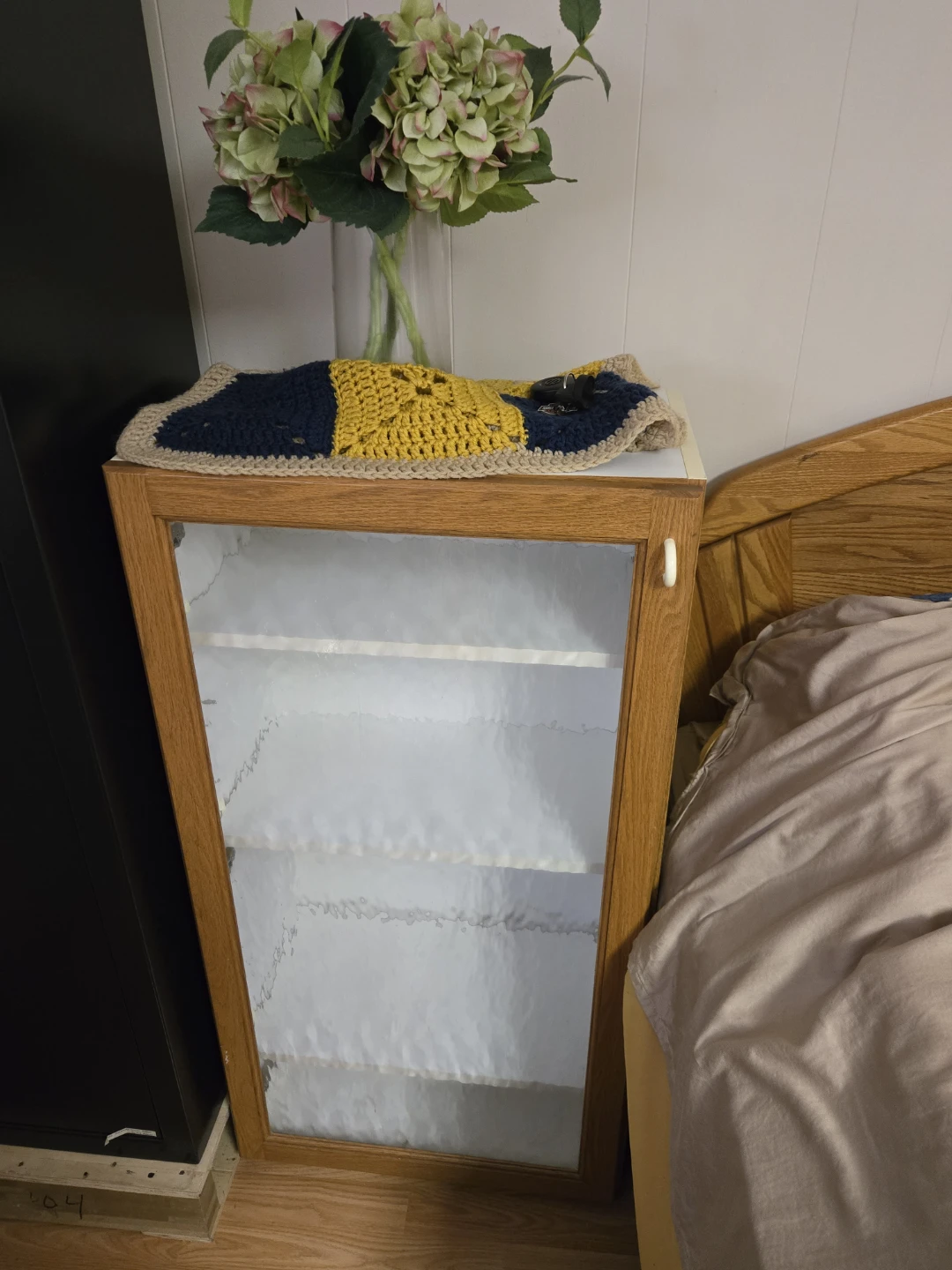 Wooden display cabinet with glass door