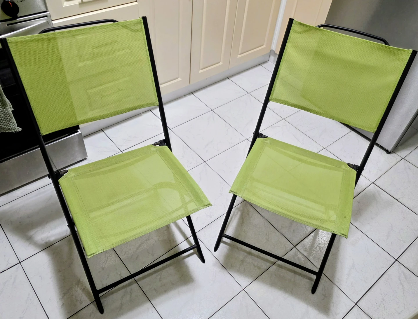 Two folding bistro chairs