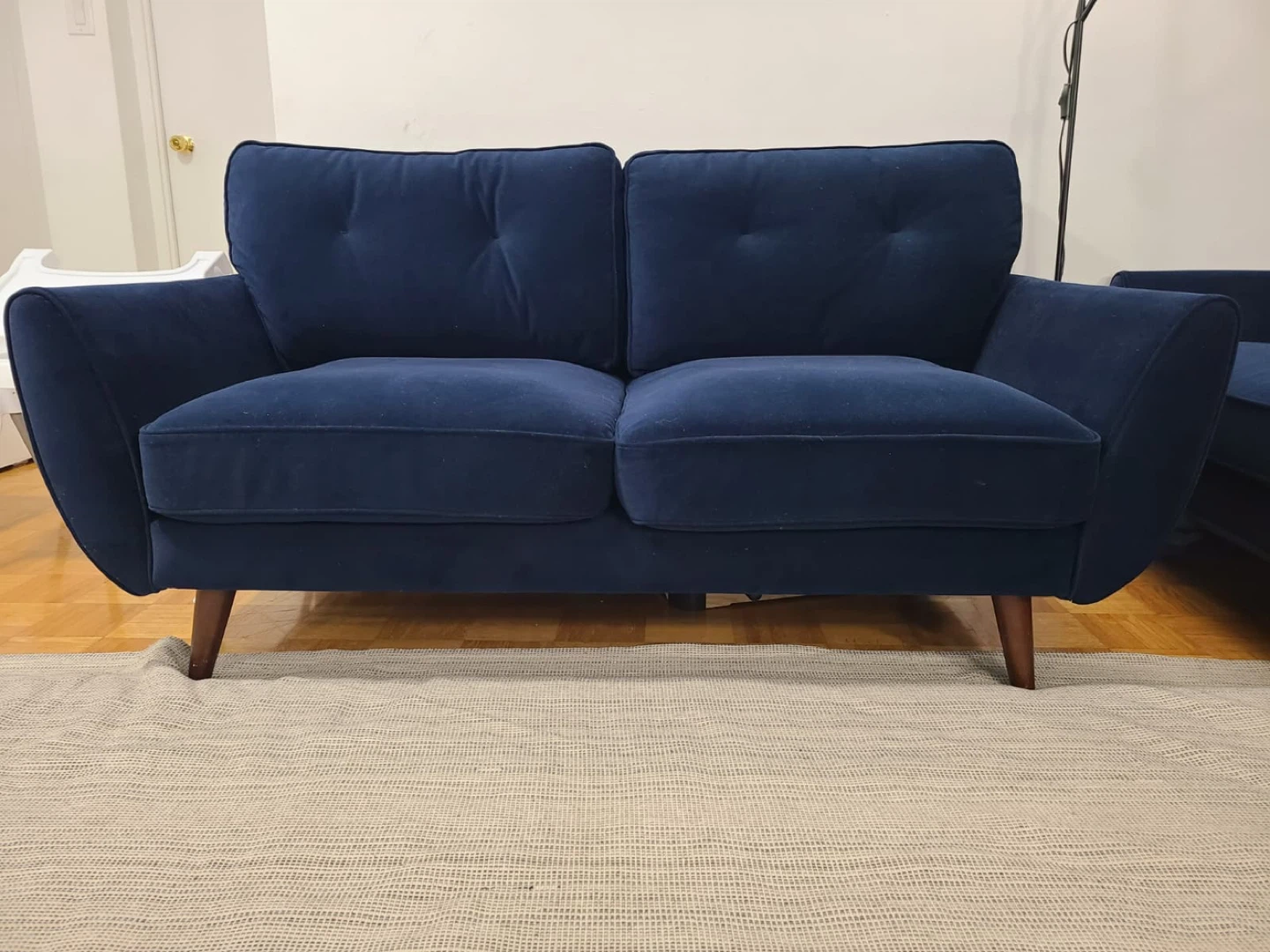 2 pieces of Navy Blue Two-Seater Sofa (small and a large sized)