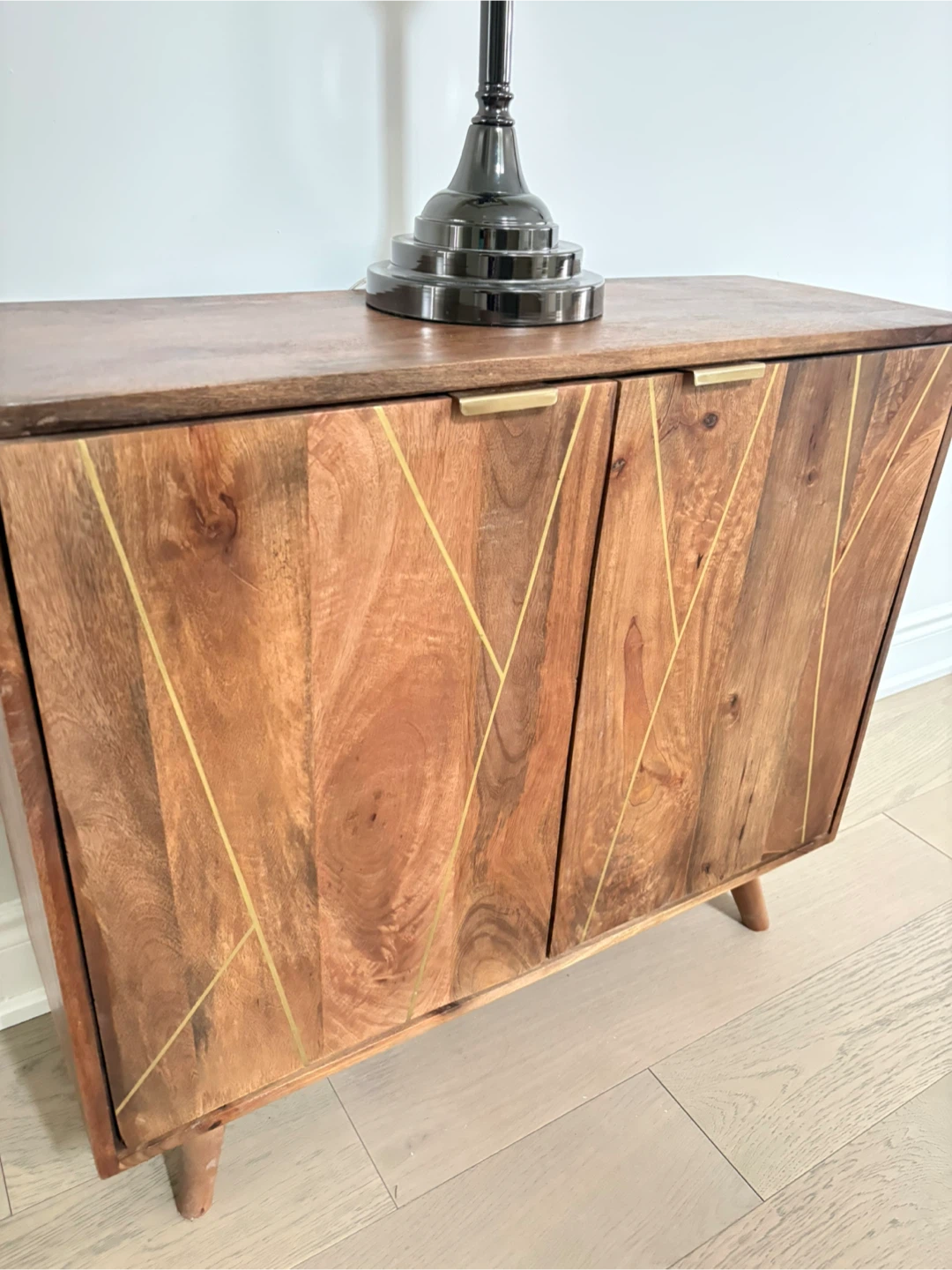 Wooden Two-Door Cabinet with Gold Accents