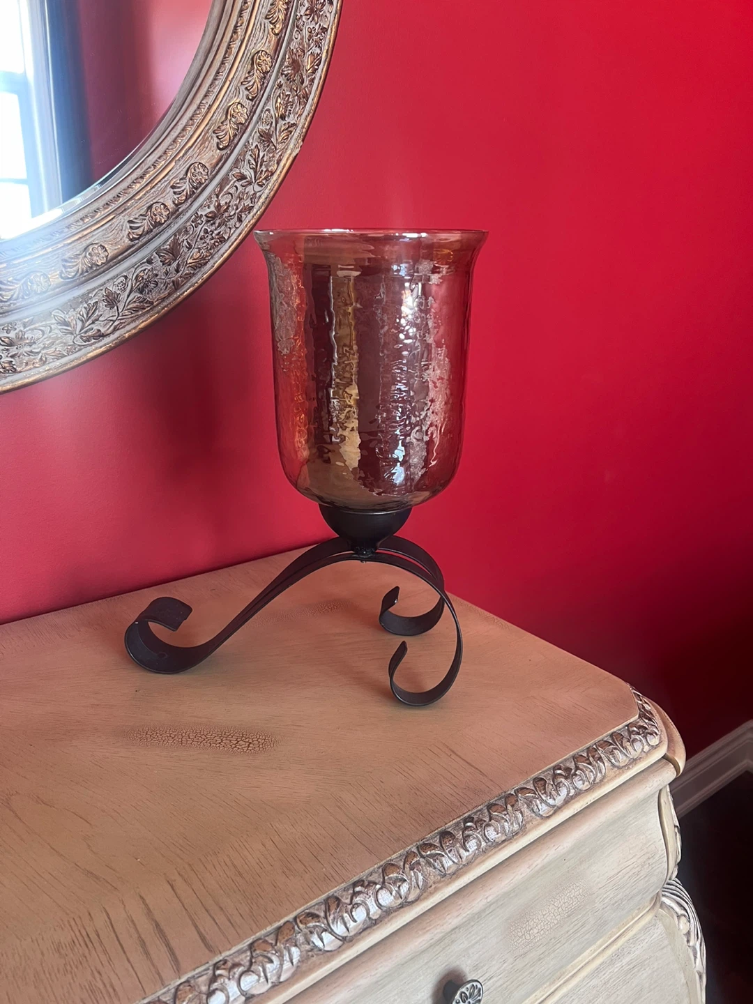 Glass hurricane candle holder on metal stand