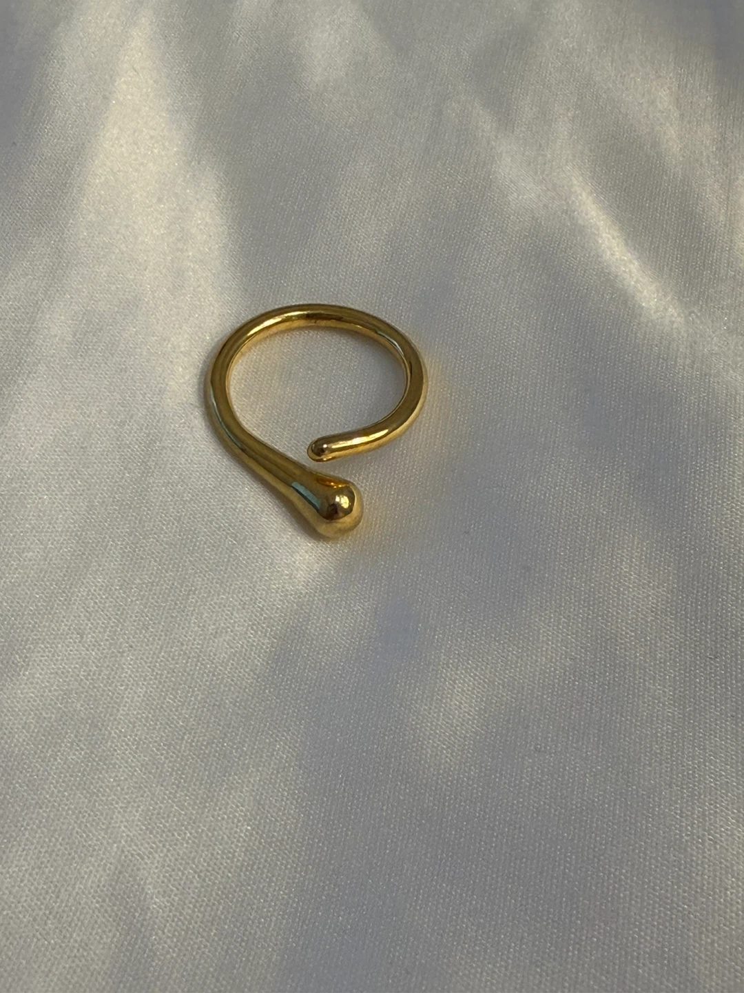 Gold-tone open ring with bead detail