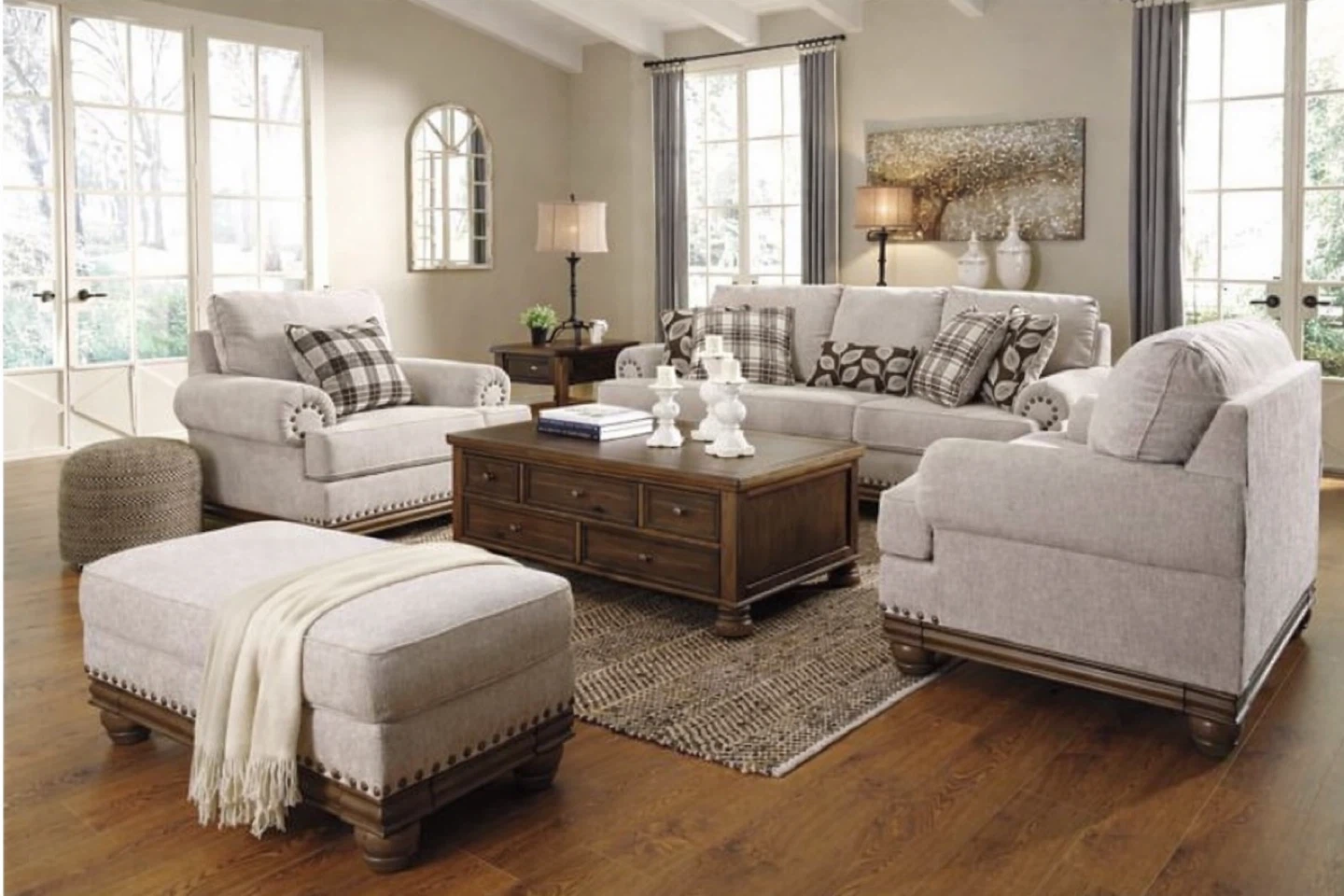 Cream Upholstered sofa , two Armchairs and an ottoman