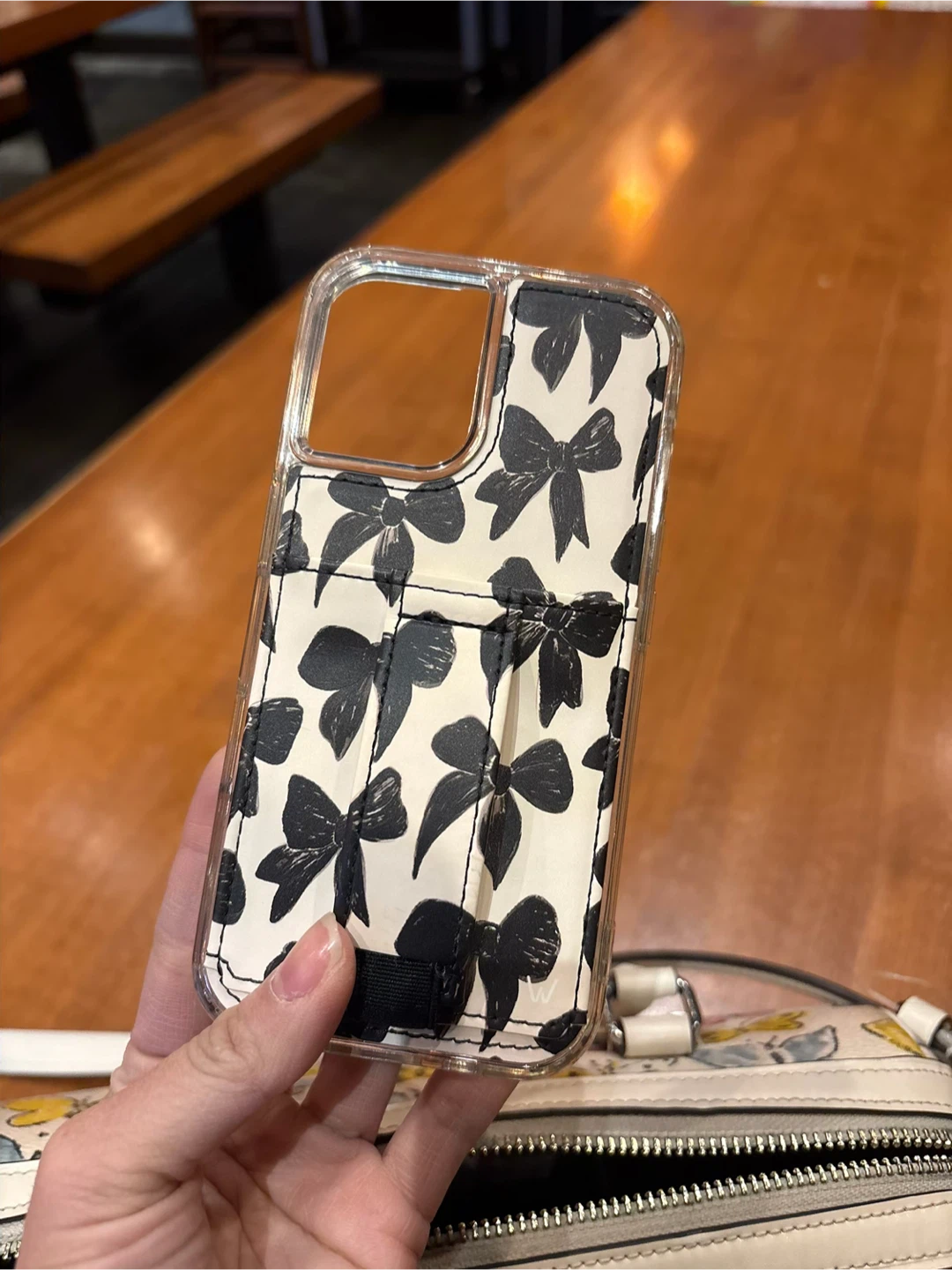 Clear phone case with black bow print