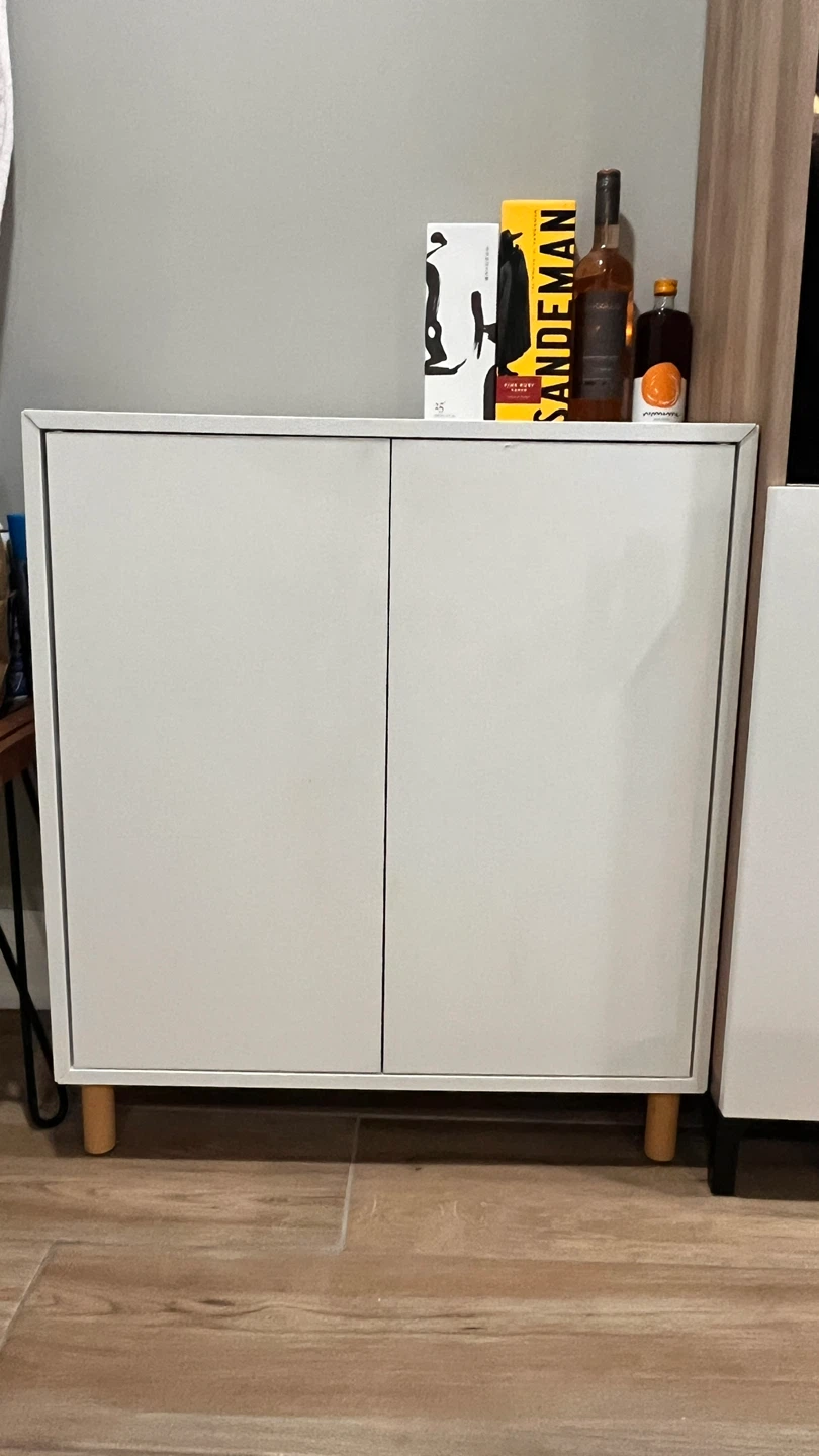 White Two-Door Cabinet with Wooden Legs