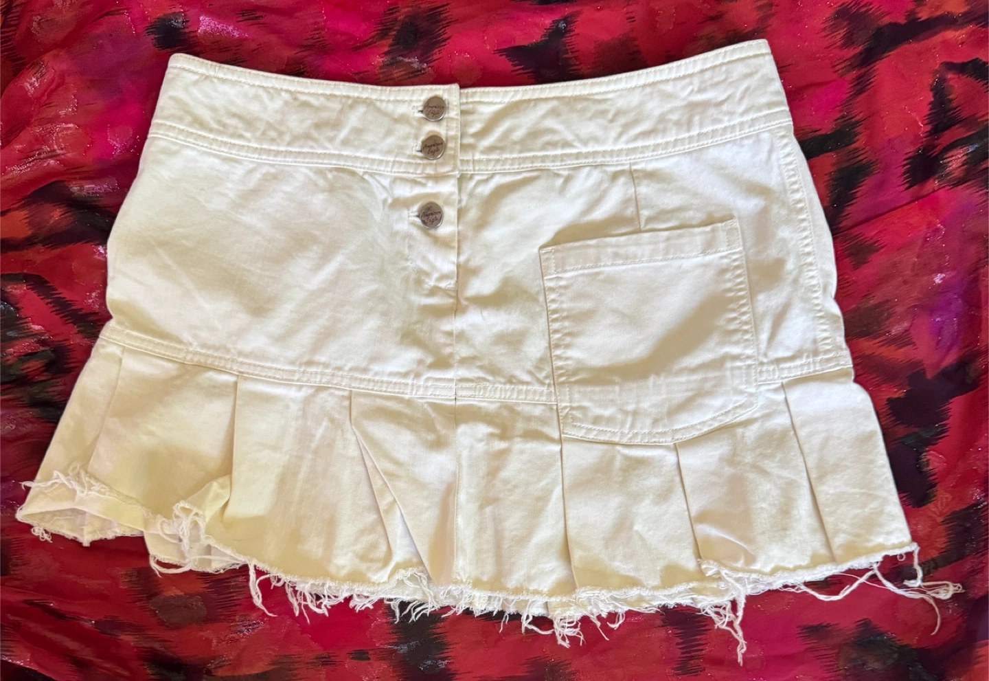 White Denim Mini Skirt with Pleats and Raw Hem