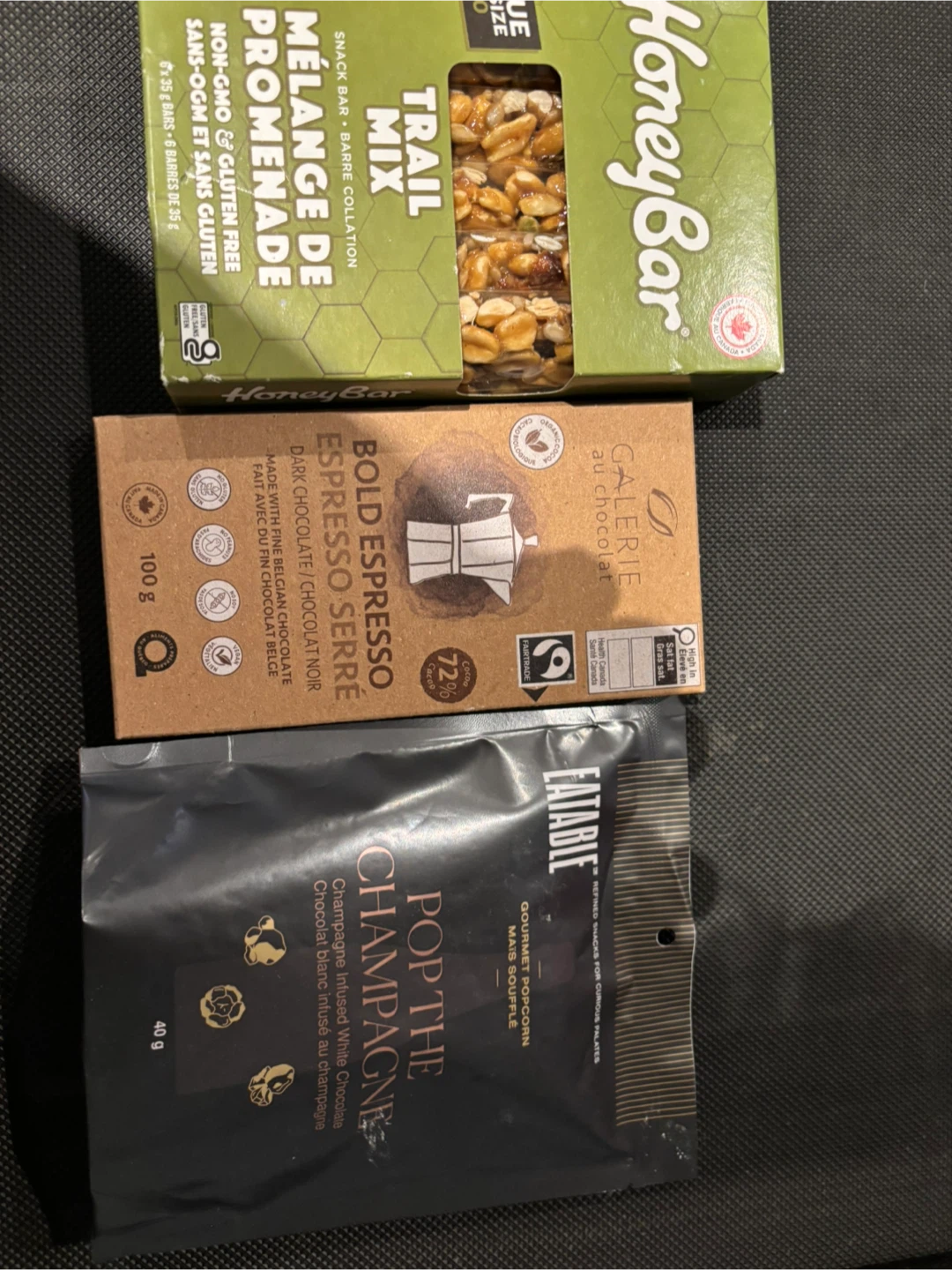 Pack of treats popcorn, chocolate and granola honey bars
