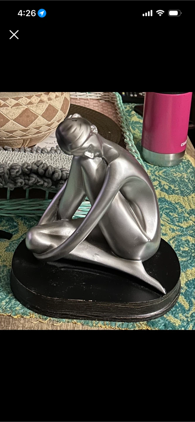 Silver Figurine of Seated Woman