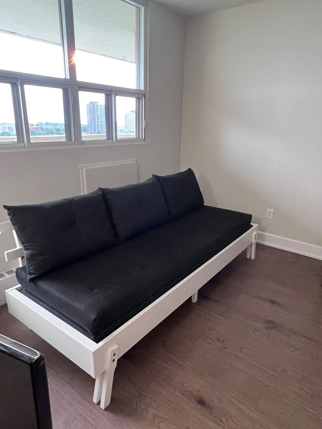 White Twin Bed Frame with Black Mattress