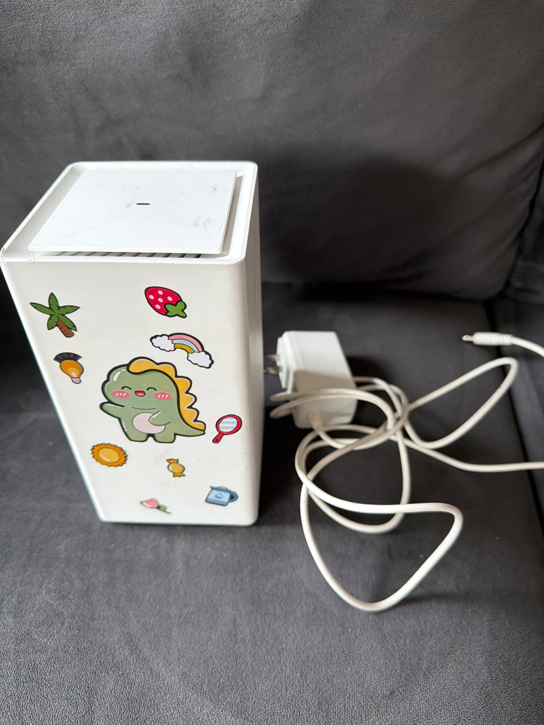 White Wireless Router with Cute Dinosaur Sticker