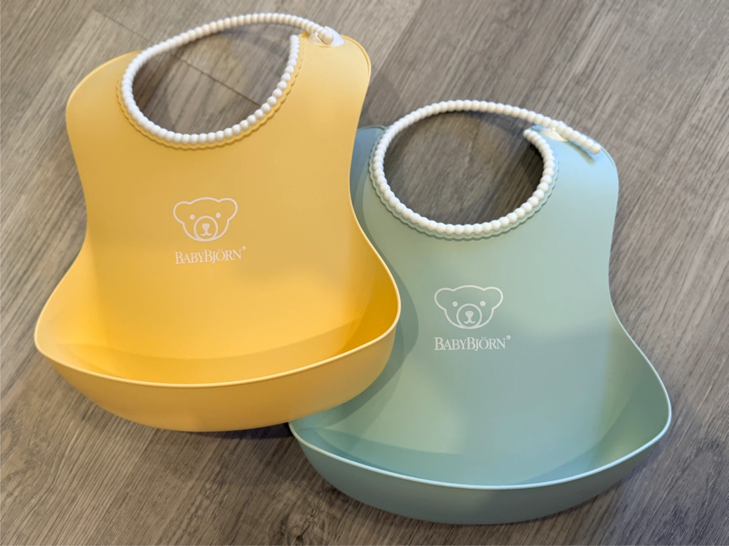Brand new bibs by Baby Bjorn