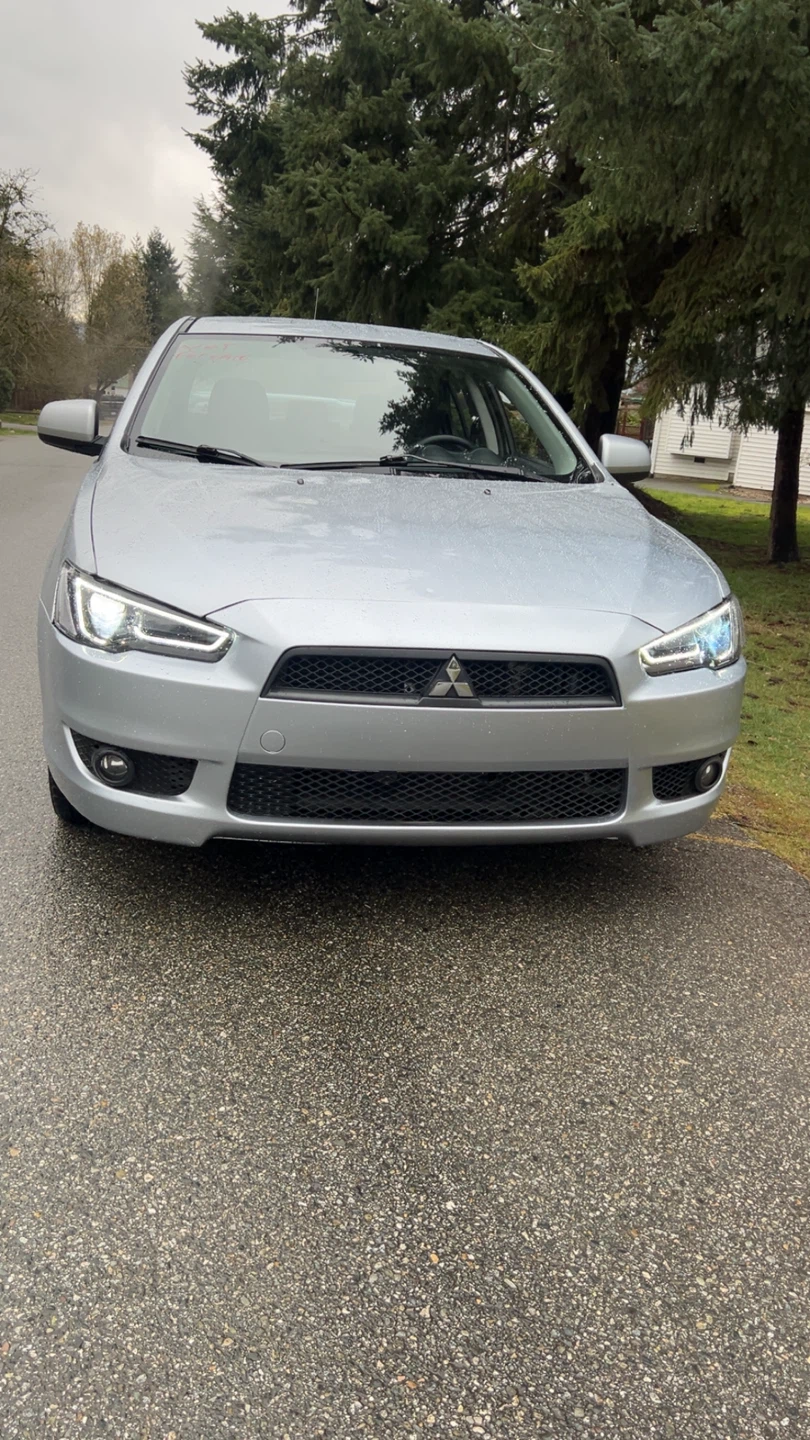 Silver Mitsubishi Lancer with Black Rims