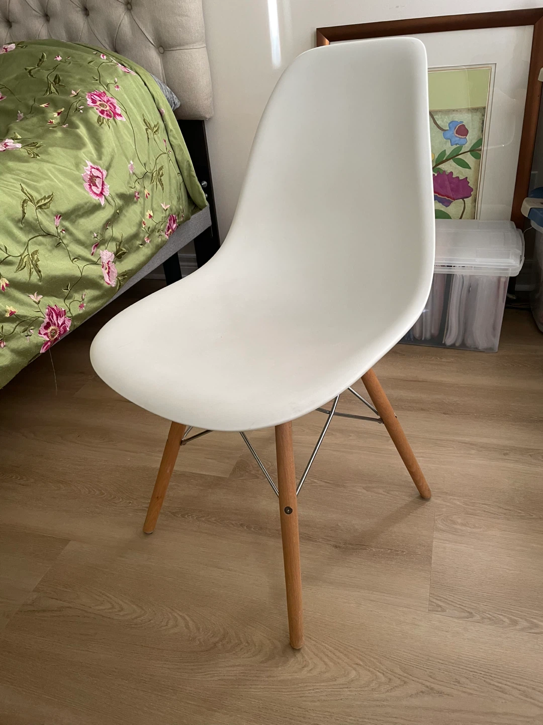 White molded accent chair with wood legs