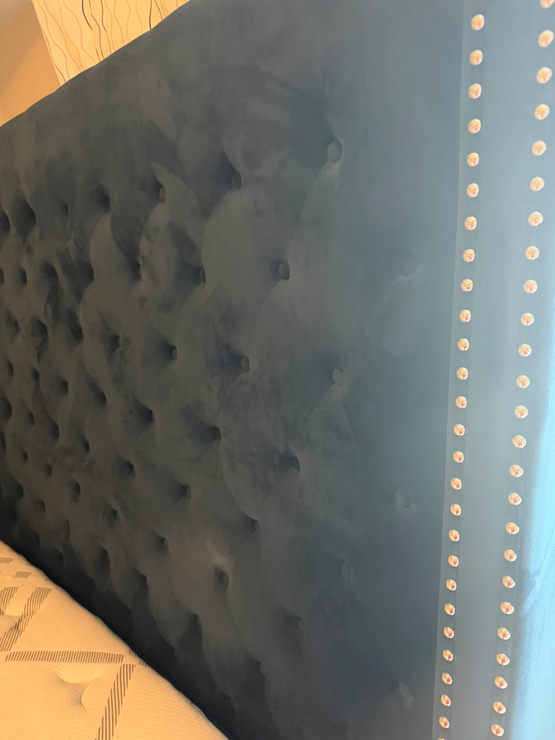 Mattress with Blue Tufted Headboard