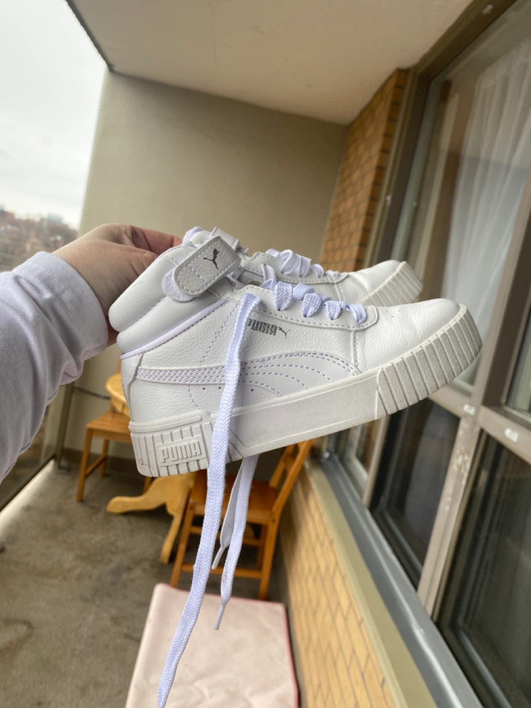 Puma white mid-top sneakers