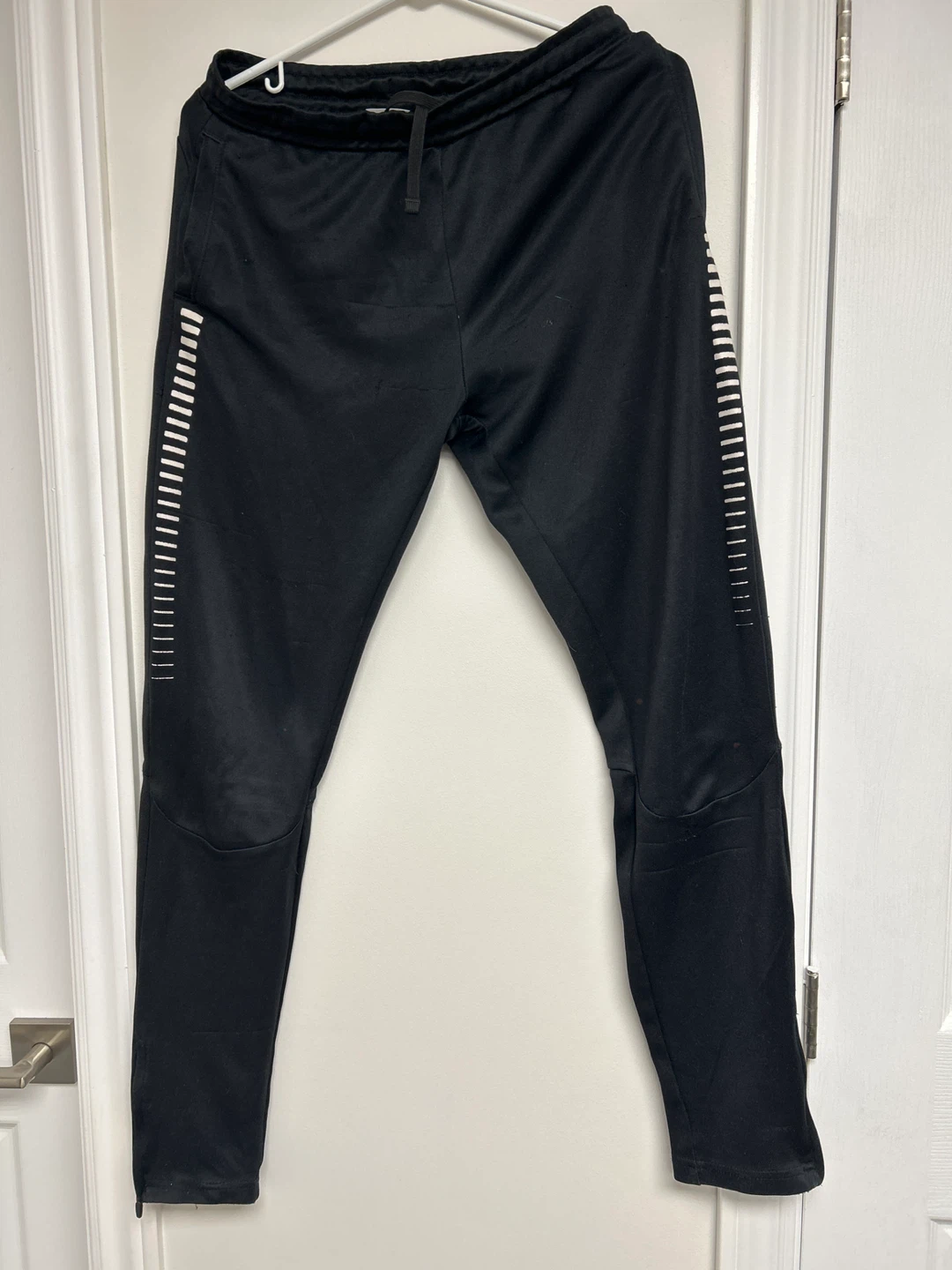 Nike Black Track Pants with White Stripe Detail