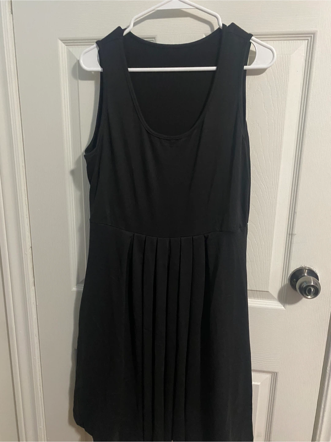 Black Sleeveless Dress with Pleated Skirt