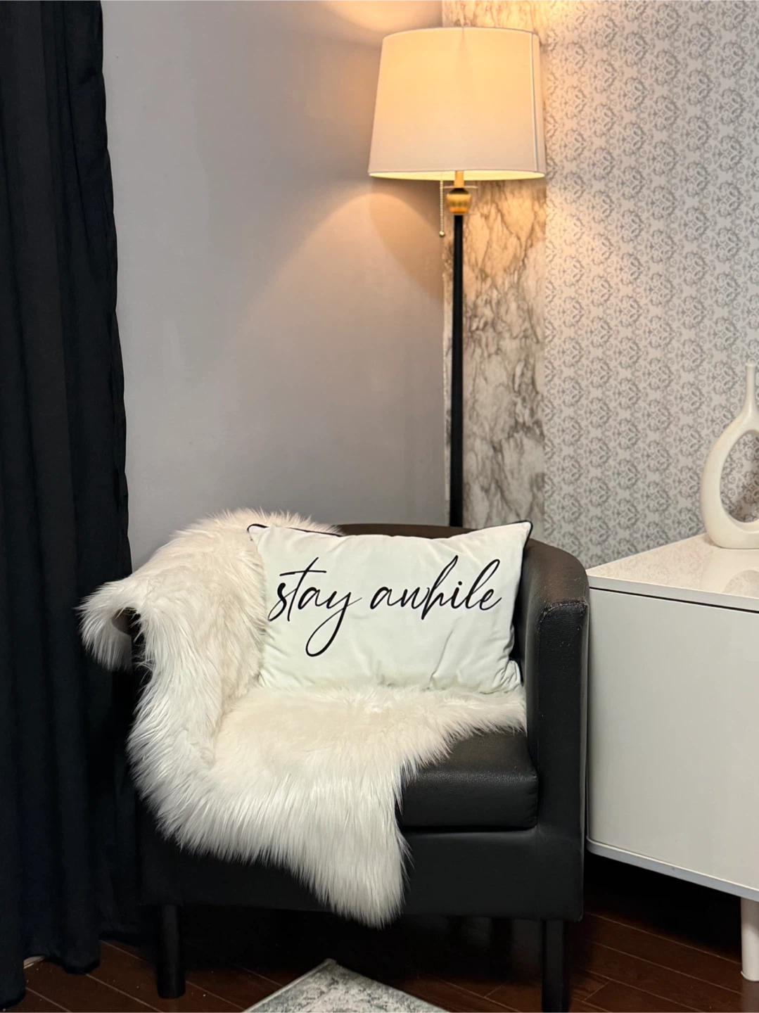 Black Faux Leather Accent Chair with white throw