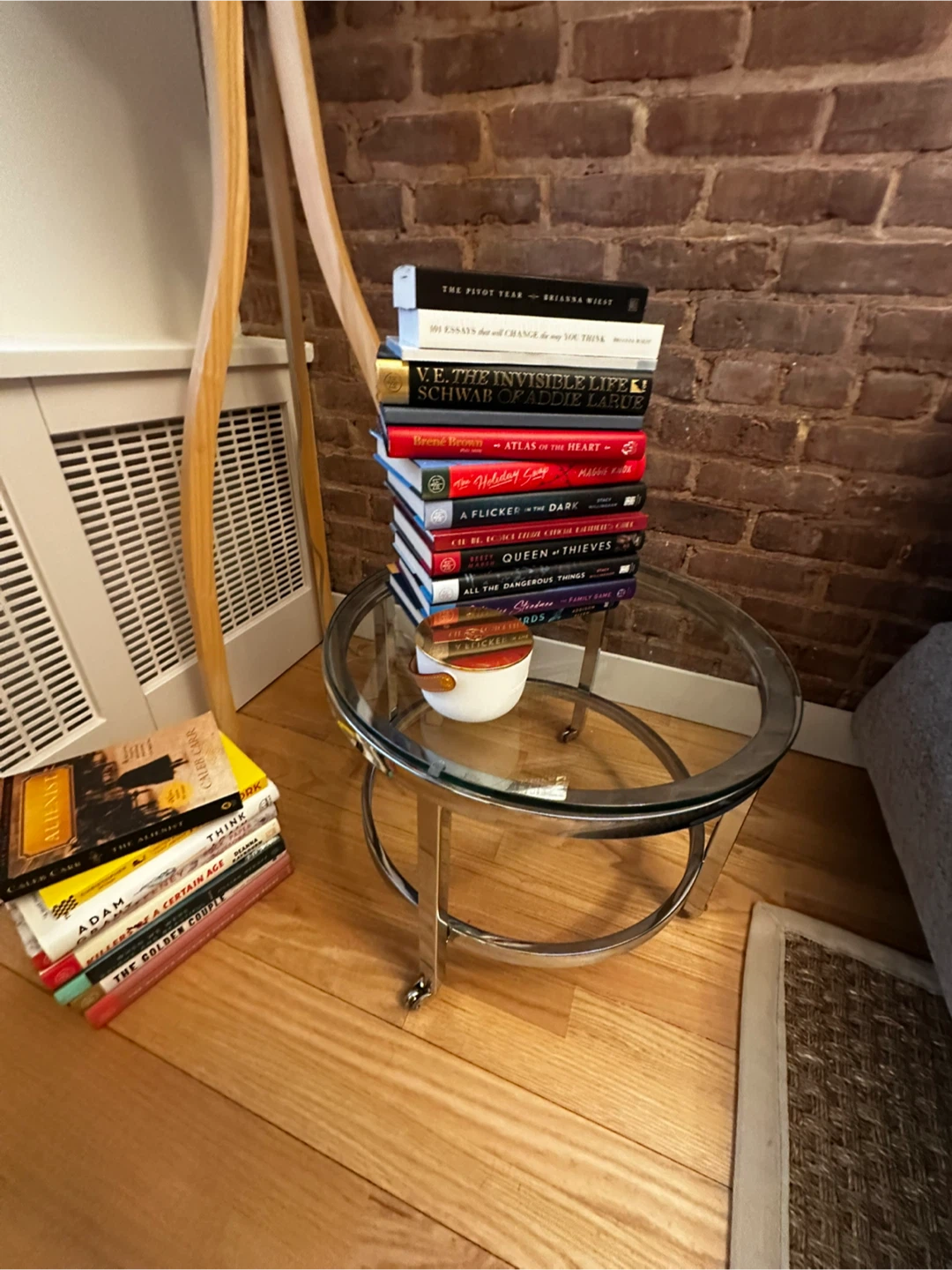 Glass top side table on wheels