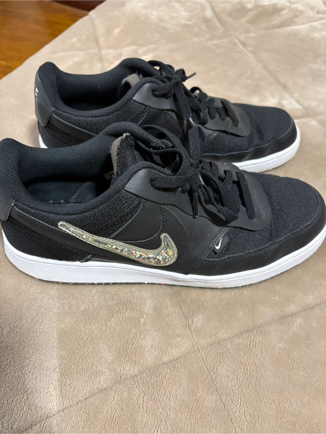 Black Nike Low Court Vision sneakers