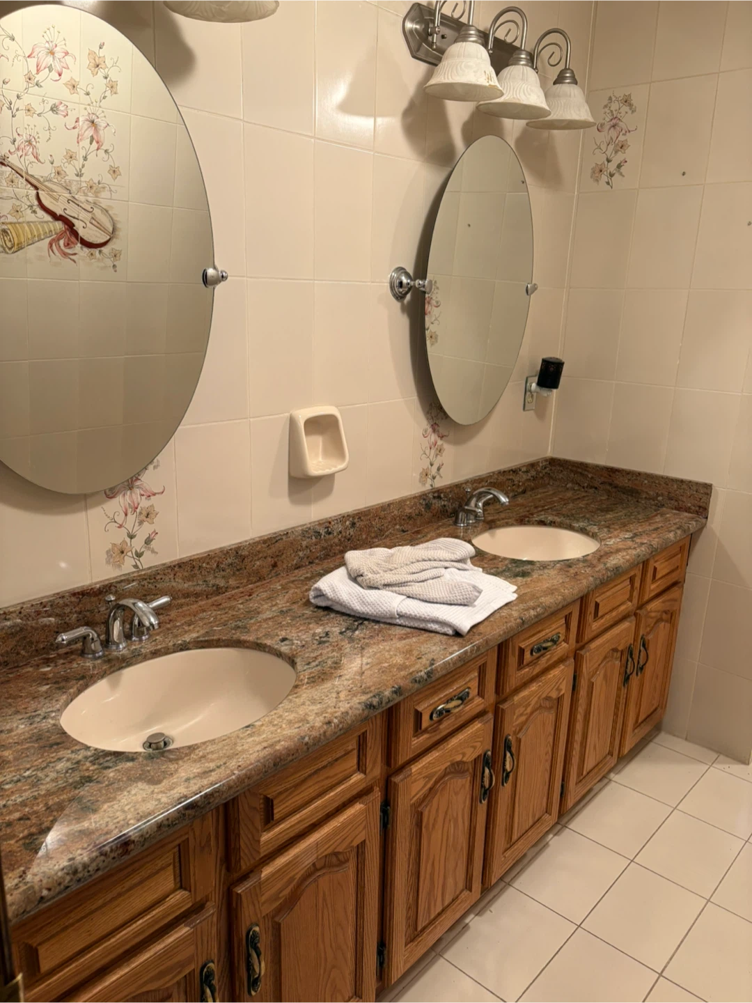 Double Sink Vanity with Granite Countertop and Oak Cabinets