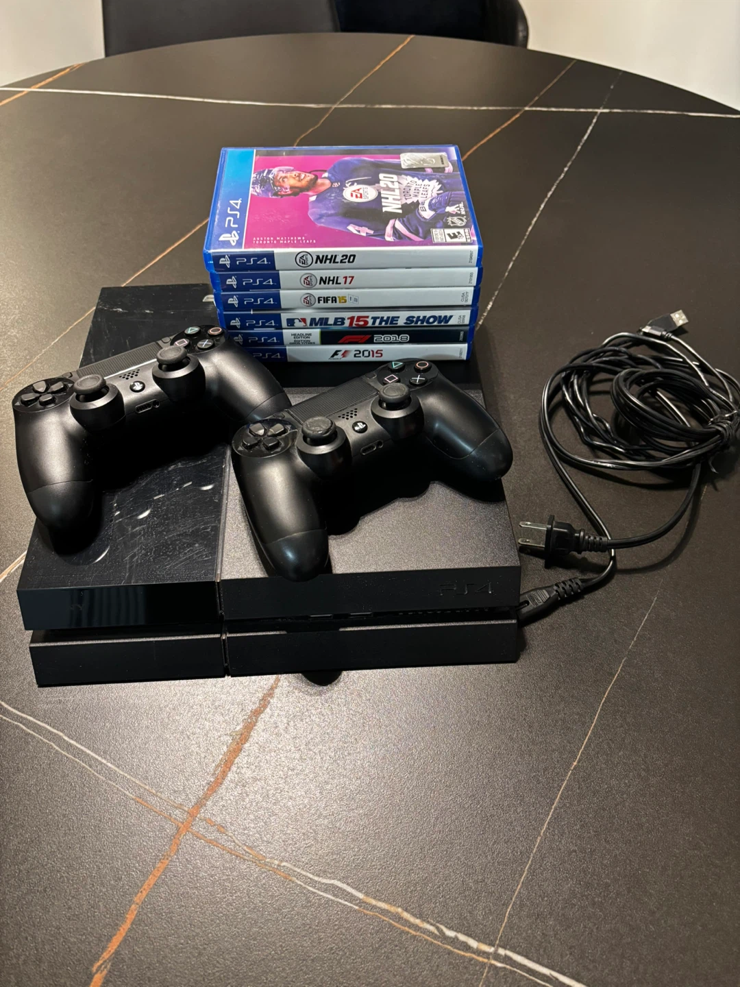 PlayStation 4 Console with 5 Games and 2 Controllers