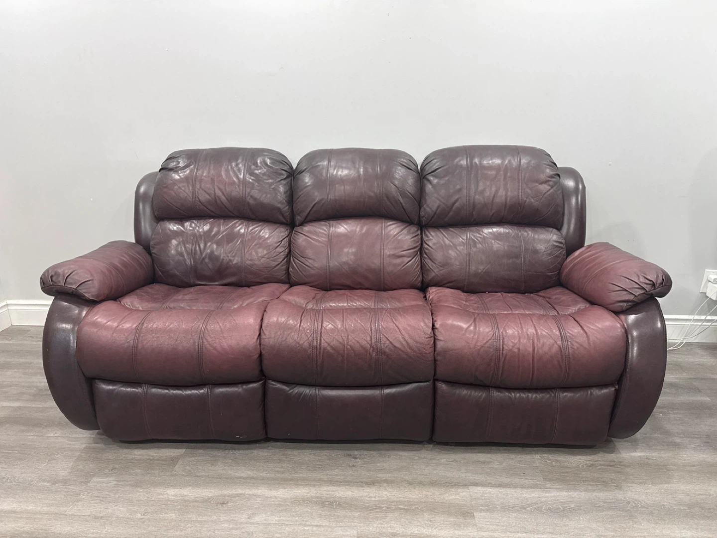 Used Leather Reclining Sofa - Burgundy